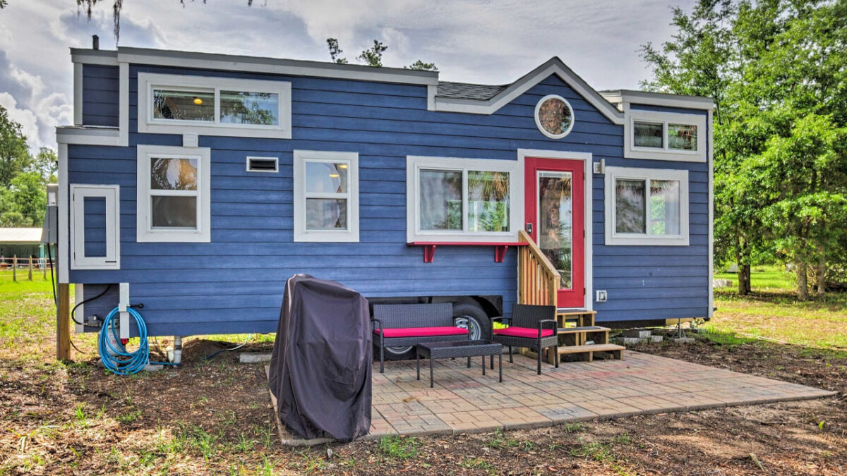 Waterfront Tiny House With Bay Window Offers Twin Lofts