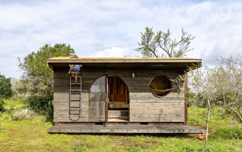 Cargo Tiny House has Swinging Doors in Bedroom, Rooftop Lounge