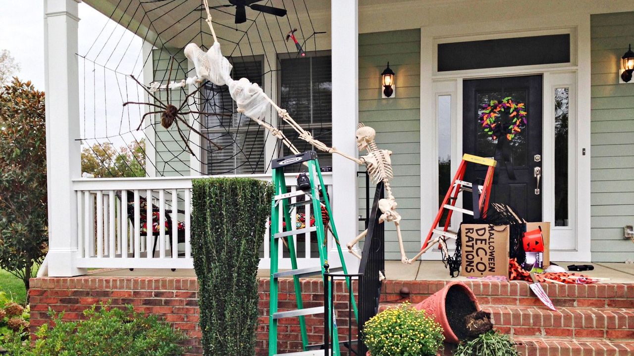 Best Outdoor Skeleton Halloween Decorations - Stuck in a web