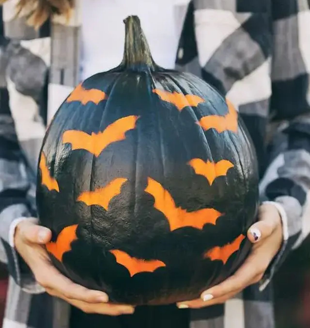 Black pumpkin stenciled with bats