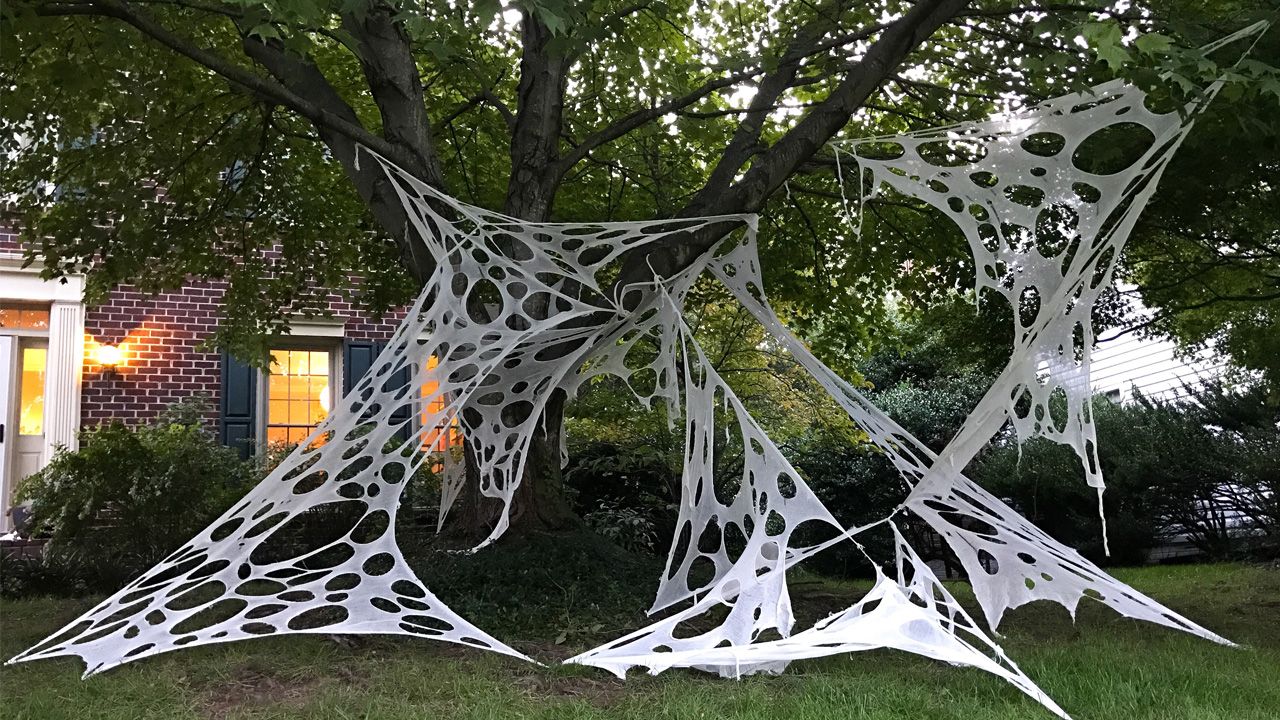 Halloween Decoration Ideas for Outdoor Trees - Weave a Spiderweb