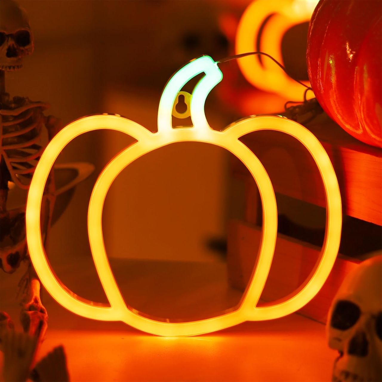 Neon orange under-shelf lights make the kitchen pop