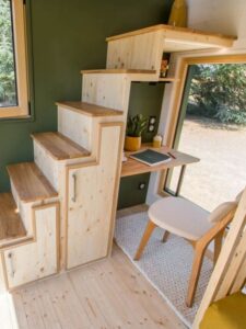 tiny house with work desk under staircase