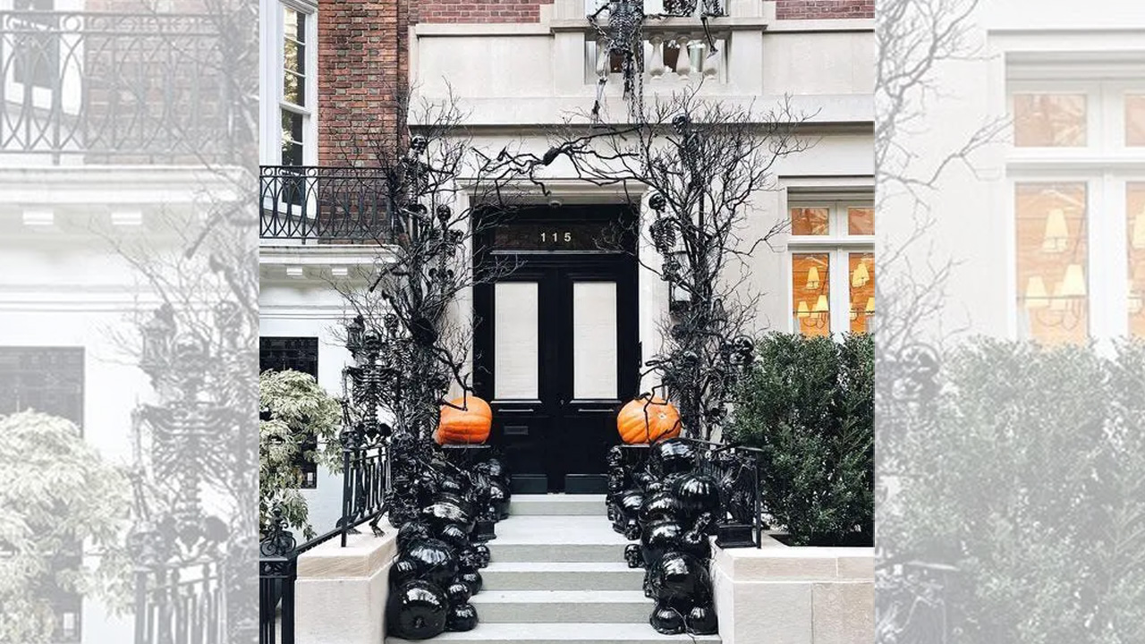 Glossy black pumpkins on the steps