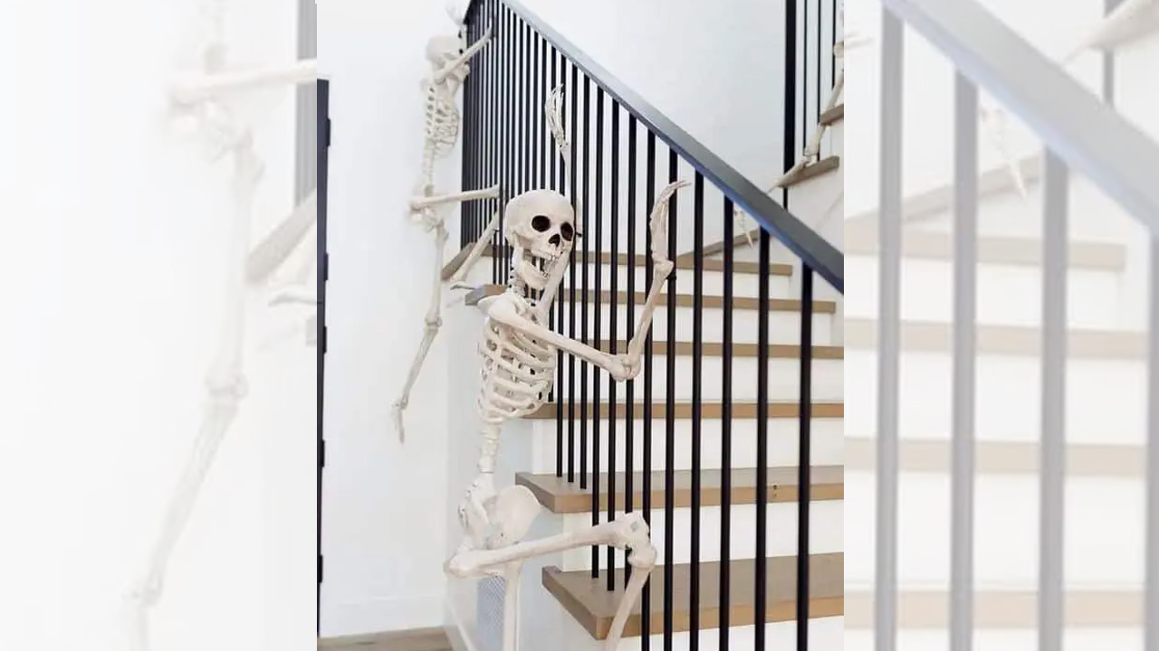 Skeletons climbing the banister look very nice and bold