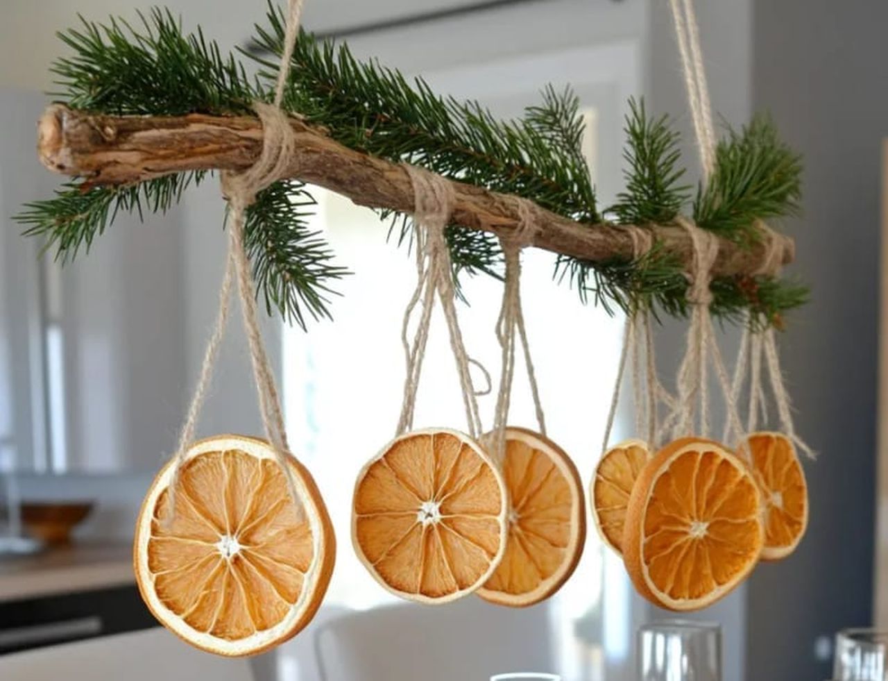 foraged branch centerpiece with hanging dried citrus