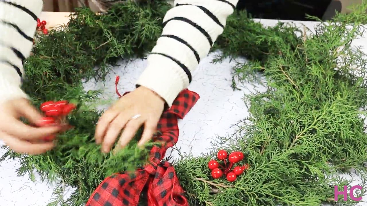 Last-Minute Evergreen Cypress Wreath - add a festive ribbon bow and berries