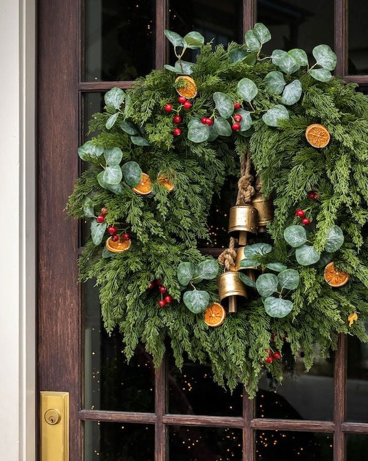 hanging bells and greenery for front porch decorations