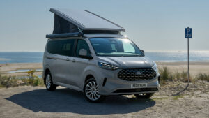 Ford Nugget Campervan With Longer Wheelbase Features Larger Kitchen and a Built-in Toilet - rooftop tent open