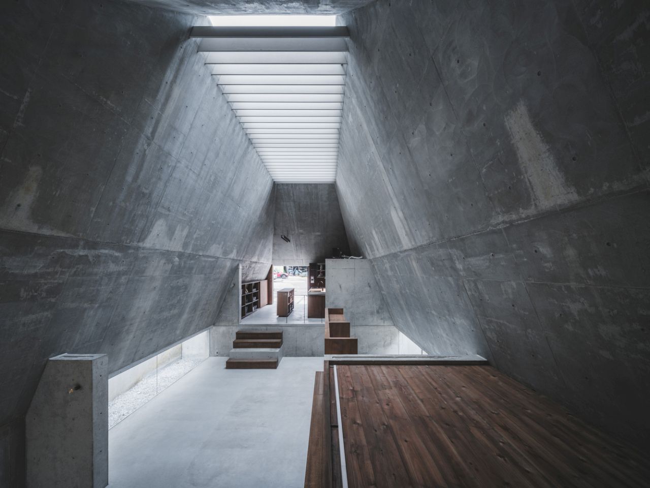 This Concrete House in Japan Embraces a Pyramid Shape to Adapt to its Sloping Site