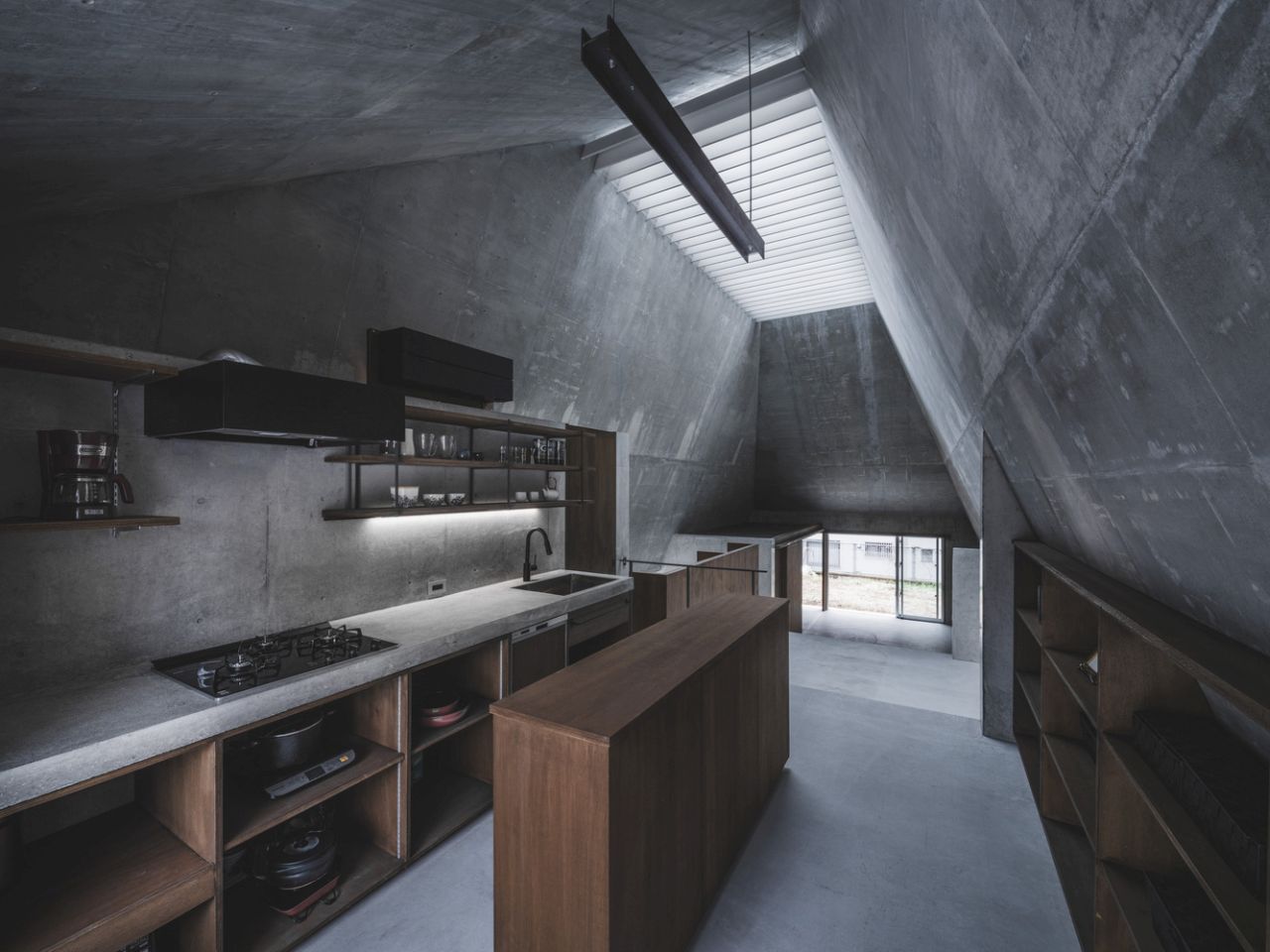 This Concrete House in Japan Embraces a Pyramid Shape to Adapt to its Sloping Site