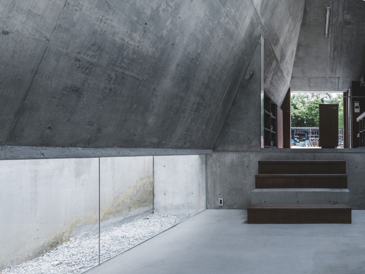 This Concrete House in Japan Embraces a Pyramid Shape to Adapt to its Sloping Site