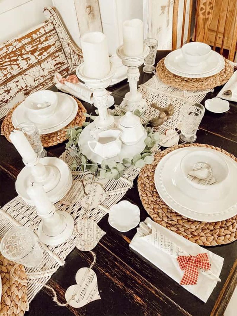 Neutral Valentine’s décor with white tableware and rattan placemats