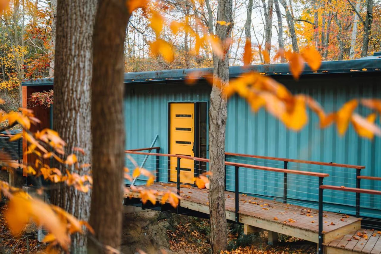 This Tiktok-Famous Shipping Container Cabin in Ohio Perches Over a Waterfall