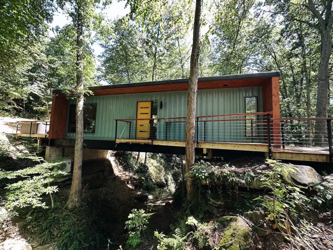 This Tiktok-Famous Shipping Container Cabin in Ohio Perches Over a Waterfall