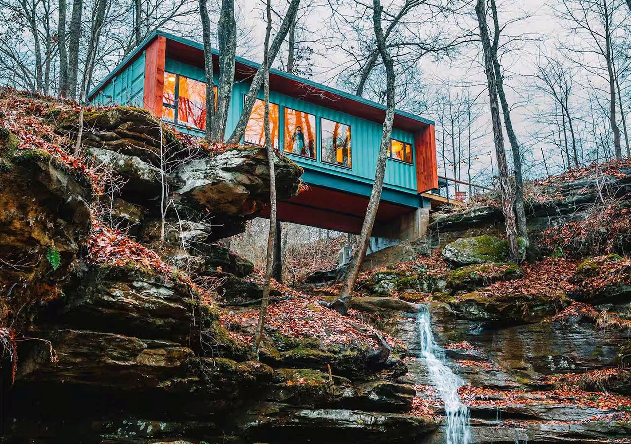 This Tiktok-Famous Shipping Container Cabin in Ohio Perches Over a Waterfall