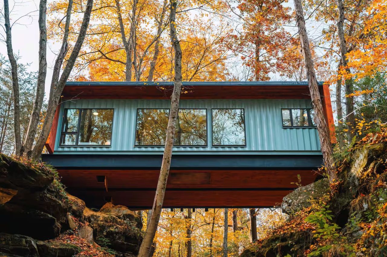 This Tiktok-Famous Shipping Container Cabin in Ohio Perches Over a Waterfall