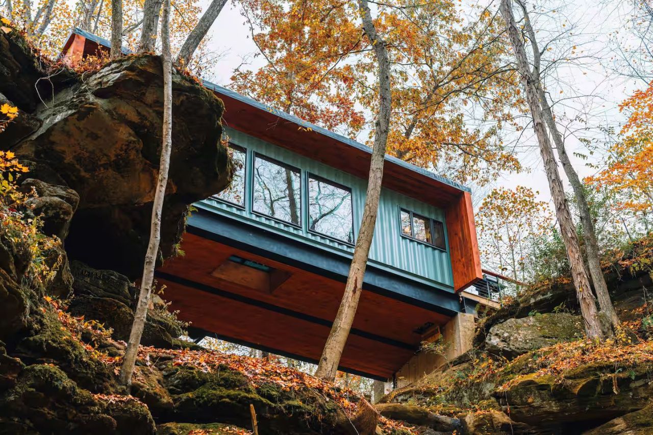 This Tiktok-Famous Shipping Container Cabin in Ohio Perches Over a Waterfall