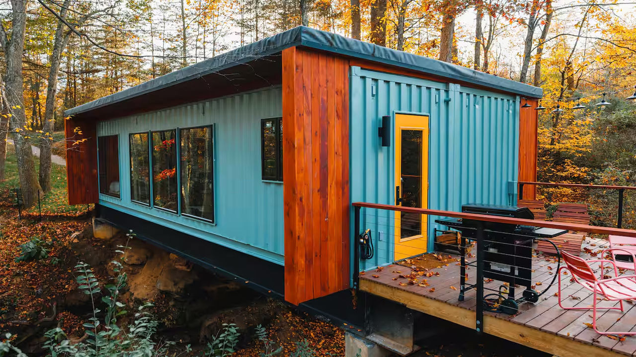 This Tiktok-Famous Shipping Container Cabin in Ohio Perches Over a Waterfall