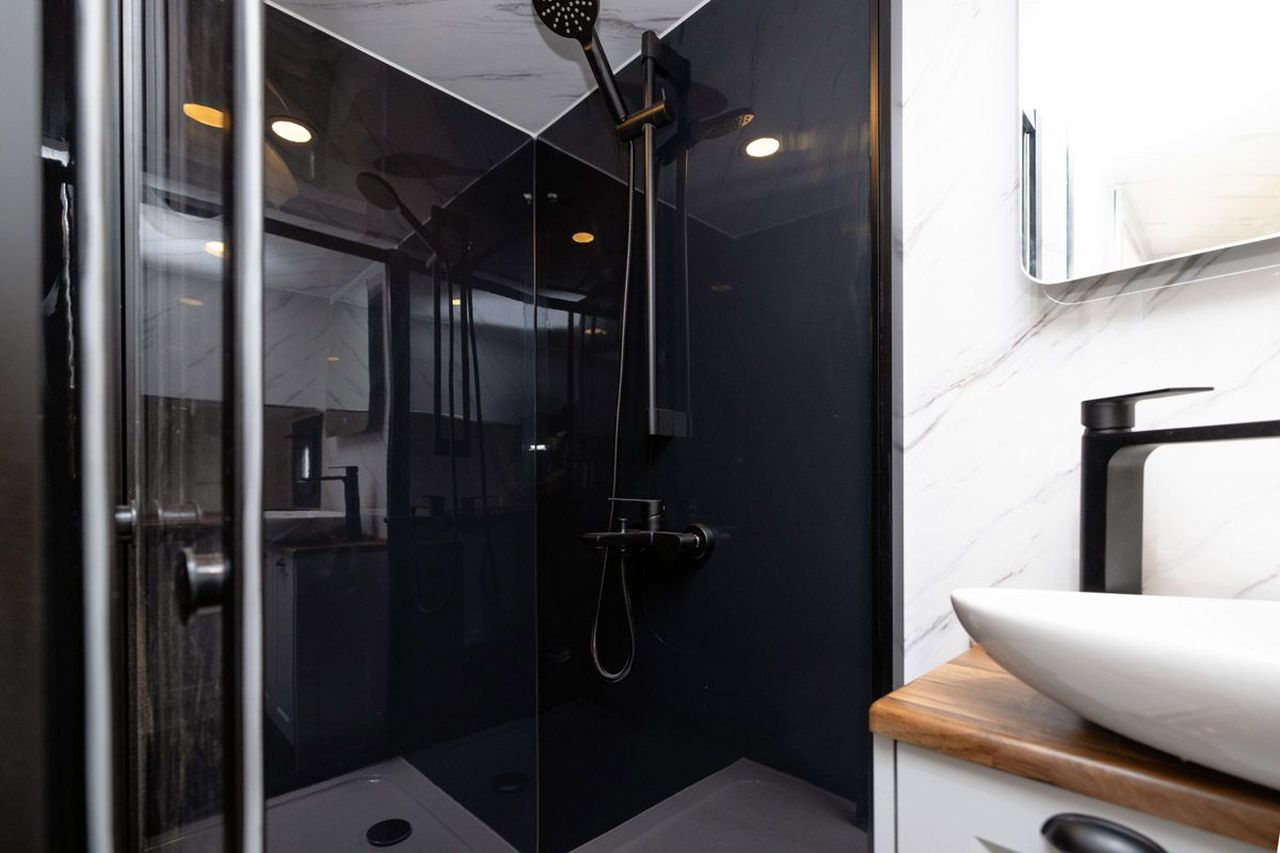 This Tiny House with Two Separate Loft Bedrooms is Suitable for Families