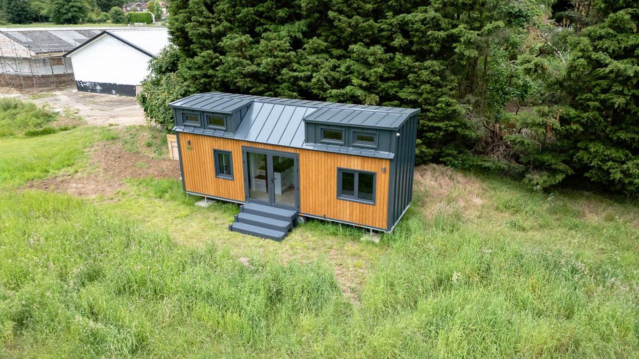 This Tiny House with Two Separate Loft Bedrooms is Suitable for Families