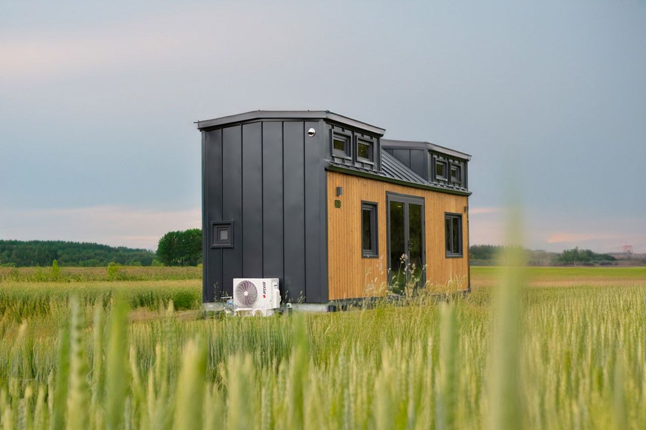 This Tiny House with Two Separate Loft Bedrooms is Suitable for Families