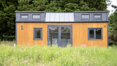 This Tiny House with Two Separate Loft Bedrooms is Suitable for Families