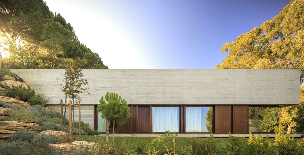 U-Shaped Residence in Portugal is Partially Buried Into Ground