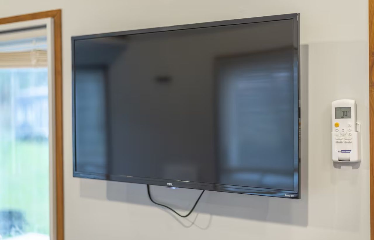 Wall-Mounted TV in Looking Glass Tiny House