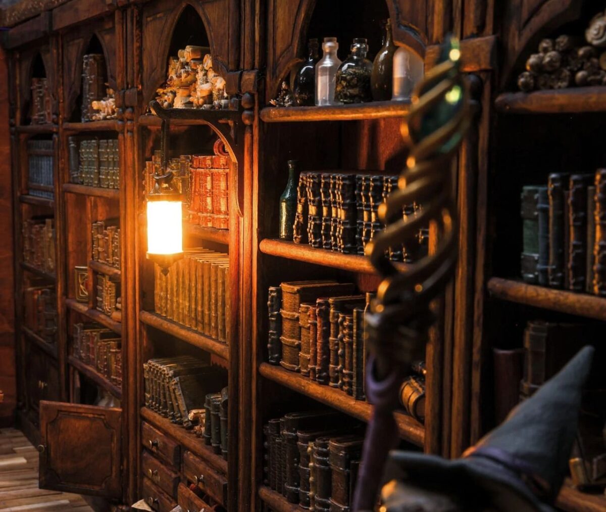This Magical Coffee Table has a Miniature Wizard’s Library Inside