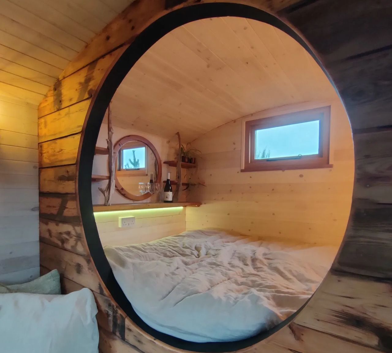 1940s Rail Carriage Turned Into Quaint Tiny Home - window bedroom 1