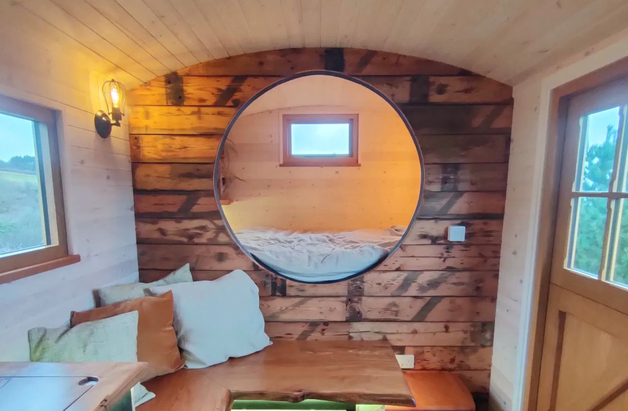 1940s Rail Carriage Turned Into Quaint Tiny Home - window bedroom