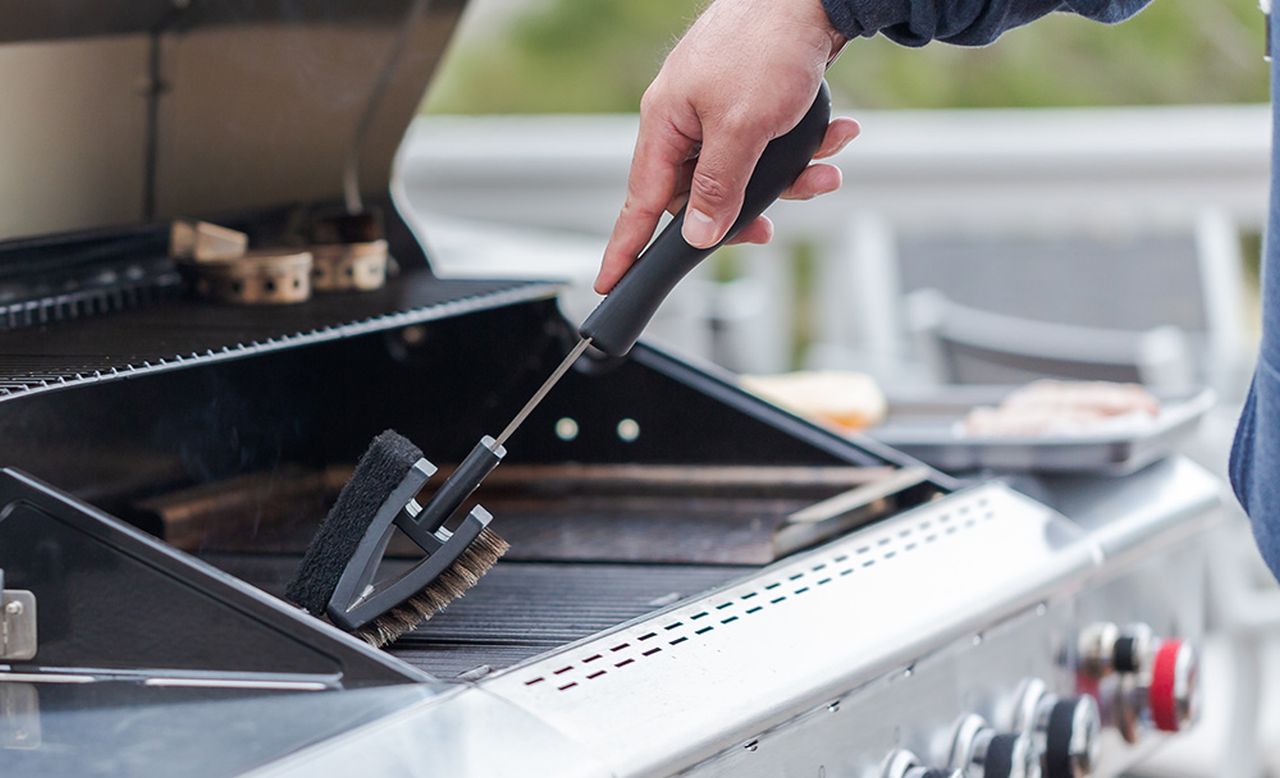 How to clean a gas grill - scrub the grates