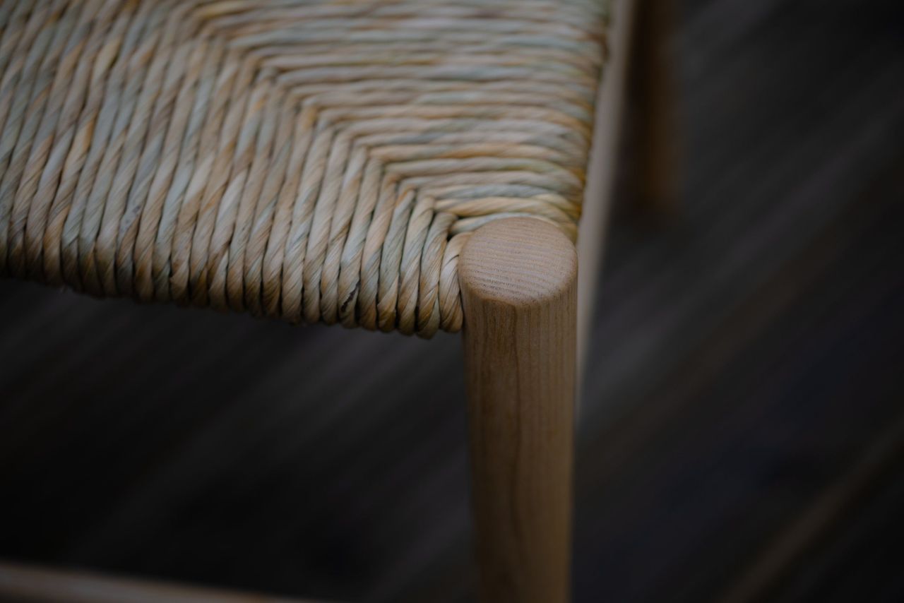 The Marchmont Workshop Canopy Chair Features Hand-Woven Rush Seat and Antler-Shaped Backrest