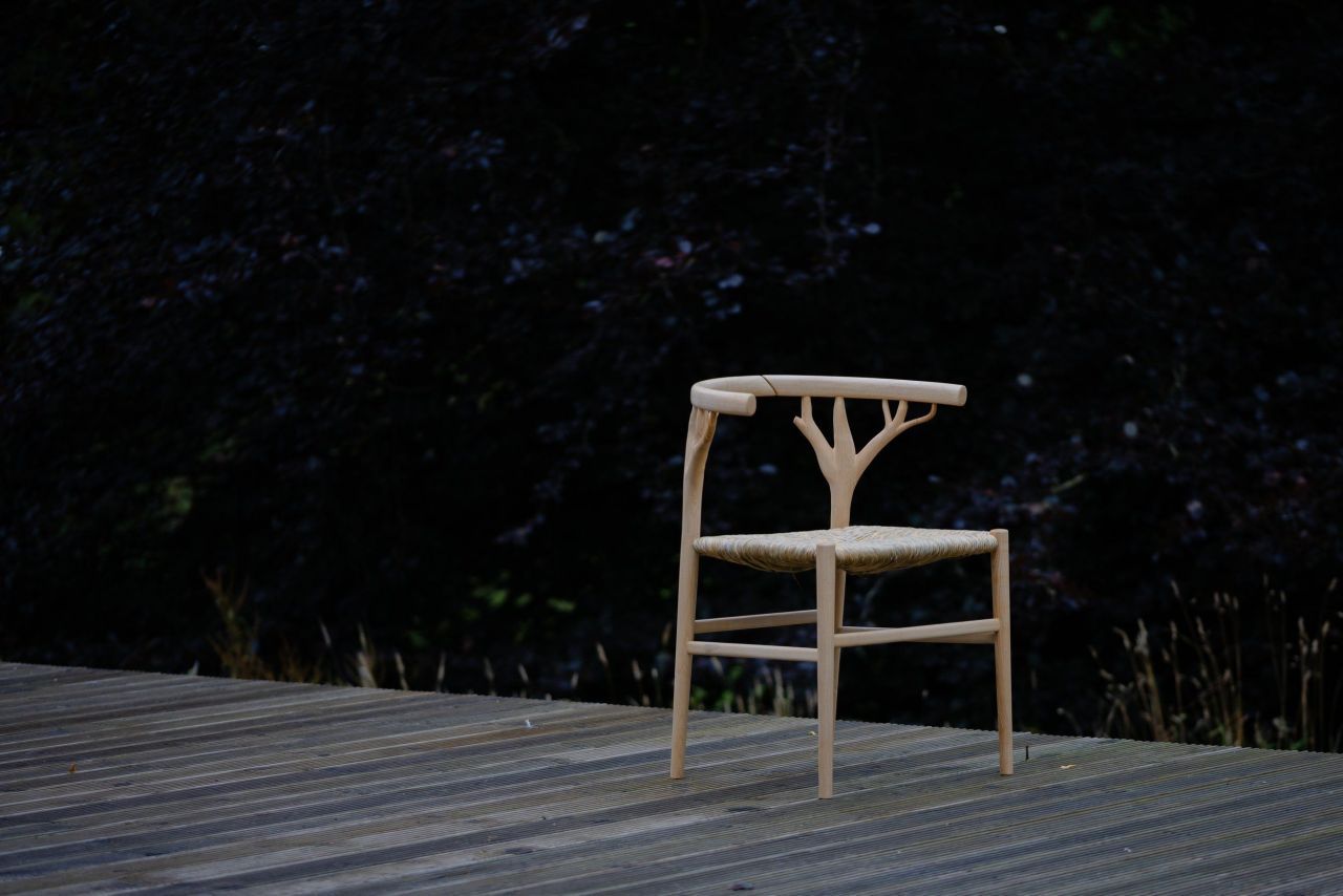 The Marchmont Workshop Canopy Chair Features Hand-Woven Rush Seat and Antler-Shaped Backrest