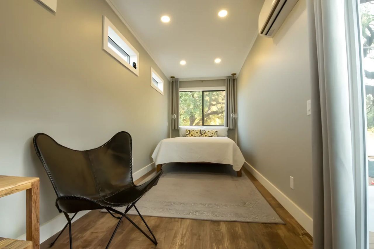 This Tiny House Made From Three Shipping Containers Features Two Decks and a Covered Patio