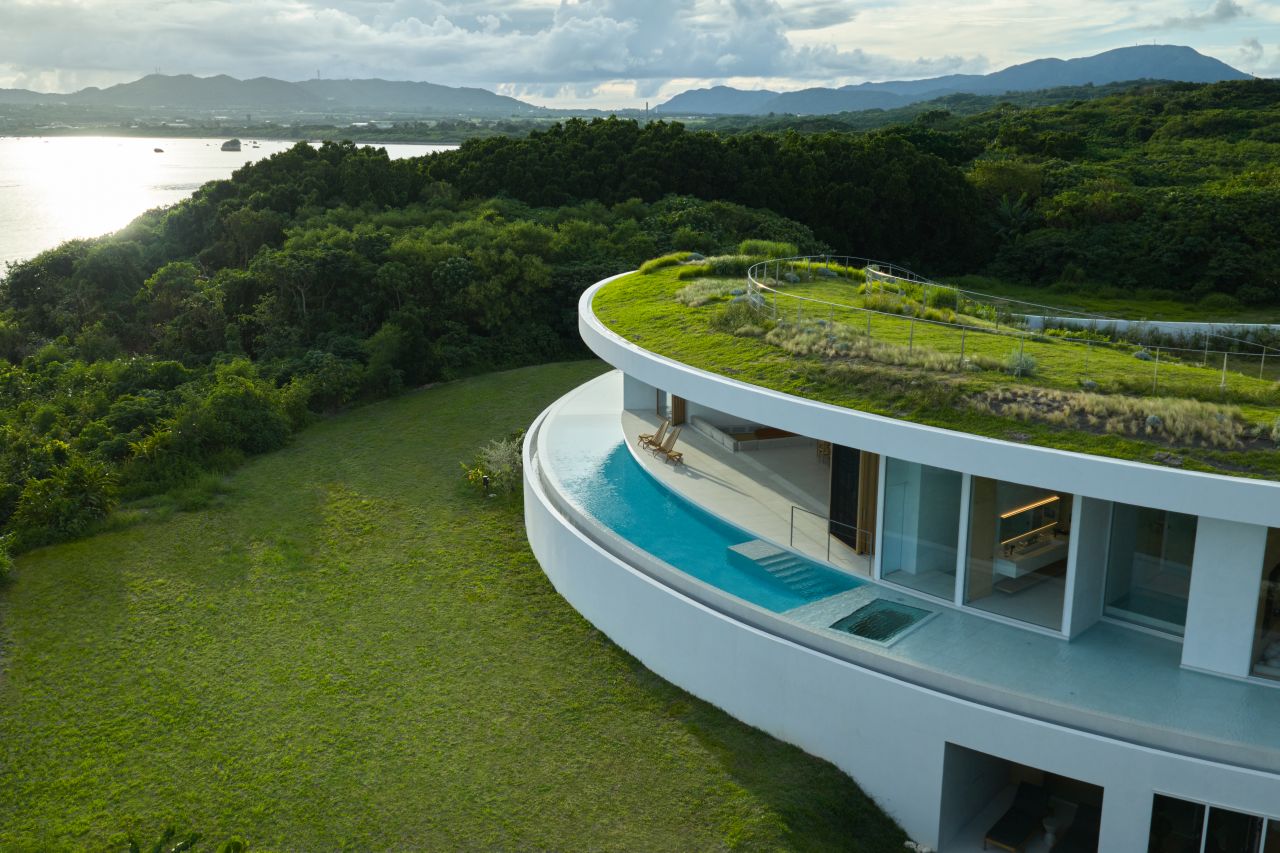 This Circular Building in Japan Features a Green Roof to Blend into its Surroundings