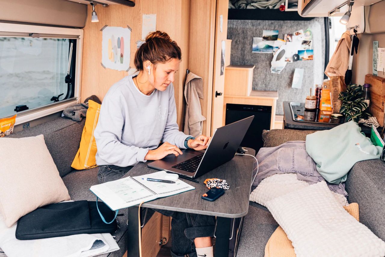 Sunlight Vanlife Camper Van with Three-Room Layout - work from home view with table in center