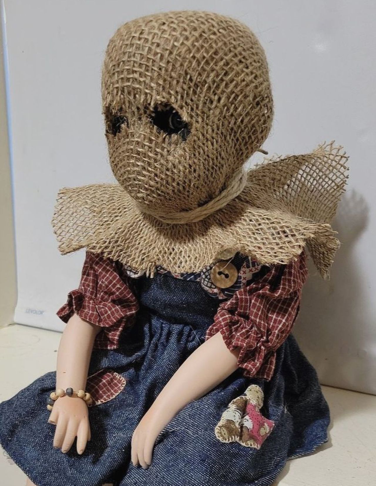 Creepy doll with a rag face for Halloween