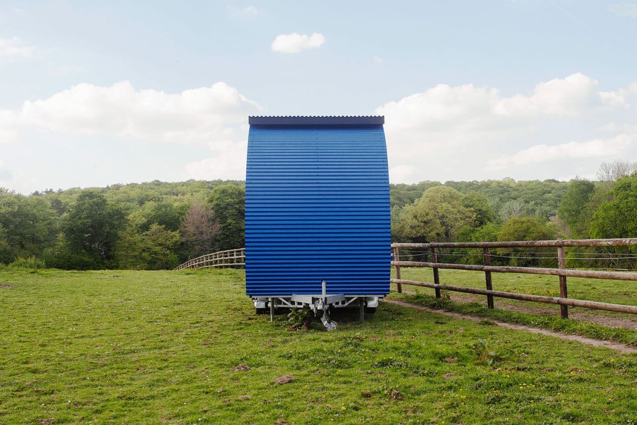 This French Tiny House on Wheels is Defined by its Porthole Windows and Vertical Silhouette
