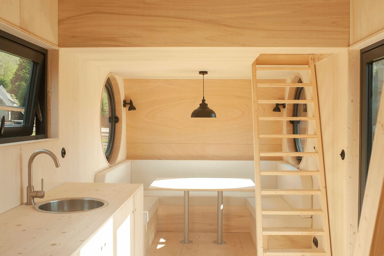 This French Tiny House on Wheels is Defined by its Porthole Windows and Vertical Silhouette