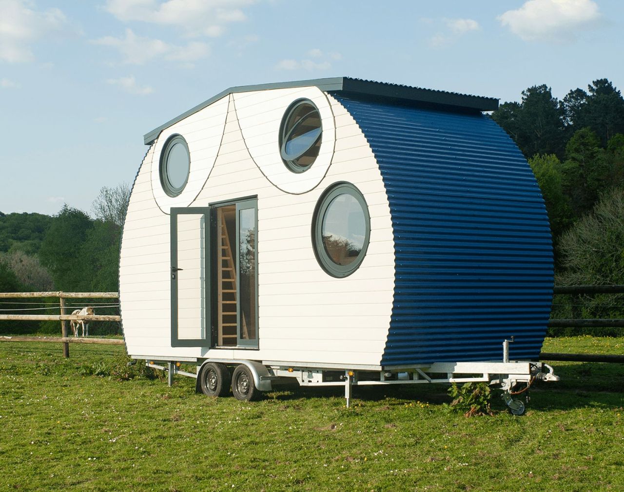 This French Tiny House on Wheels is Defined by its Porthole Windows and Vertical Silhouette