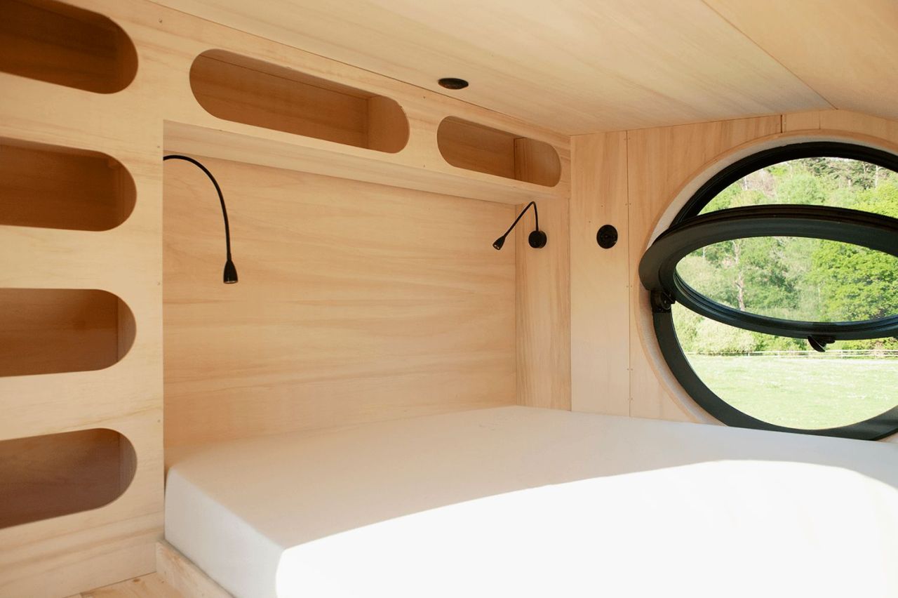 This French Tiny House on Wheels is Defined by its Porthole Windows and Vertical Silhouette