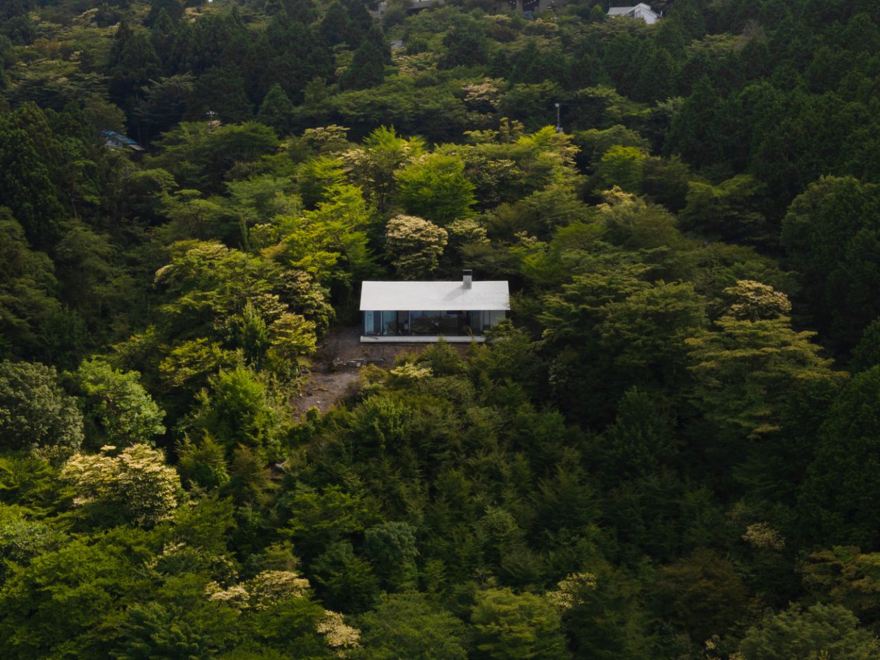 Villa T by Florian Busch Architects in Japan’s Izu Peninsula Appears Like Massive Rock From Above 