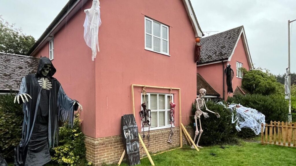 Adam Wright Builds Skeleton Halloween Display in garden