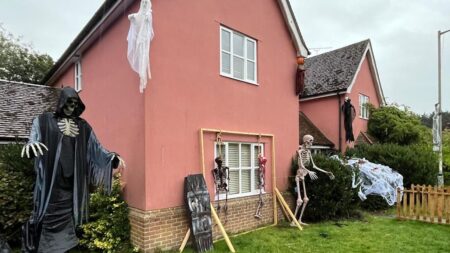 Adam Wright Builds Skeleton Halloween Display in garden