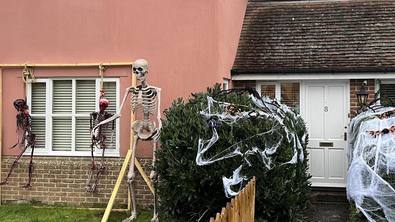 Adam Wright Builds Skeleton Halloween Display with spiderweb