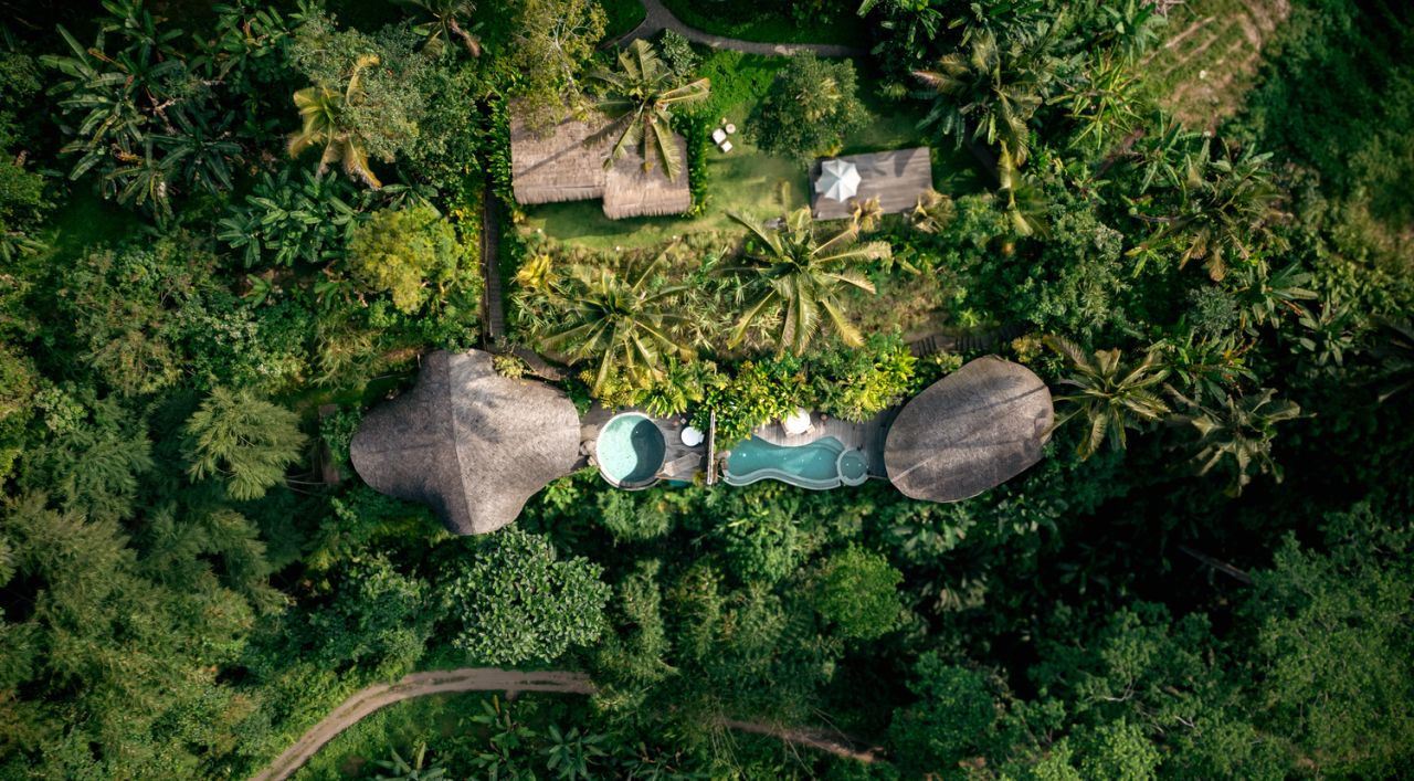 Aerial view of the Belalu Dome Villa shows unique architecture nestled in middle of rich greenery.