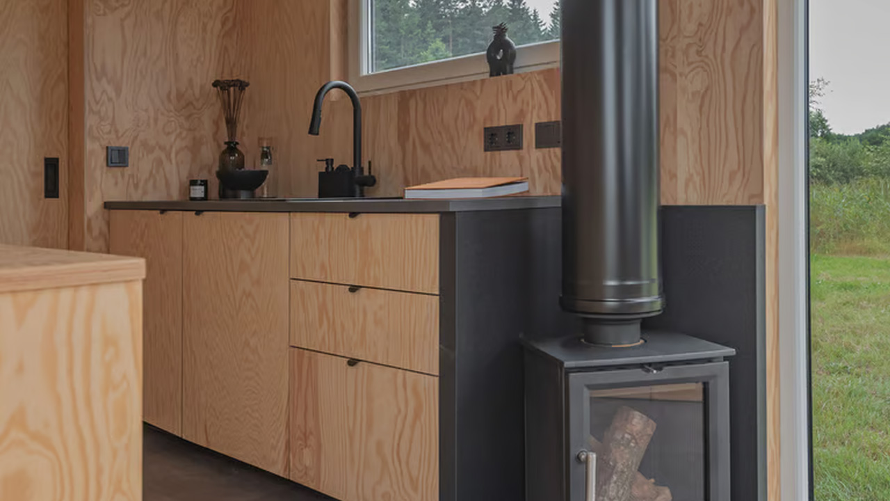 Compact but functional  kitchenette has built in drawers.