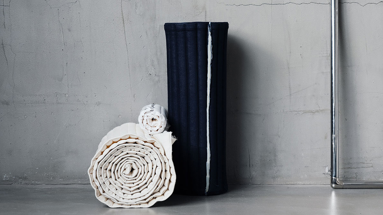 Inspired from sleeping bags and mats, the padded cushion can be rolled easily and put in the corner.
